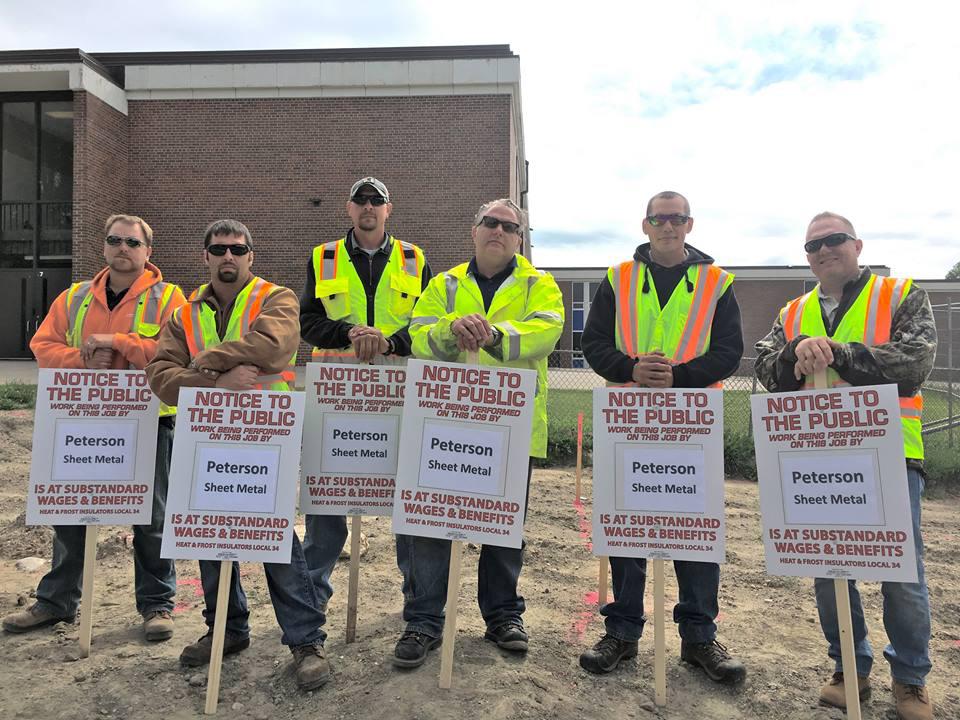 Heat and Frost Insulators Local 34 says Peterson Sheet Metal is not complying with area standards on two school projects in Waconia. Minneapolis Labor Review photo