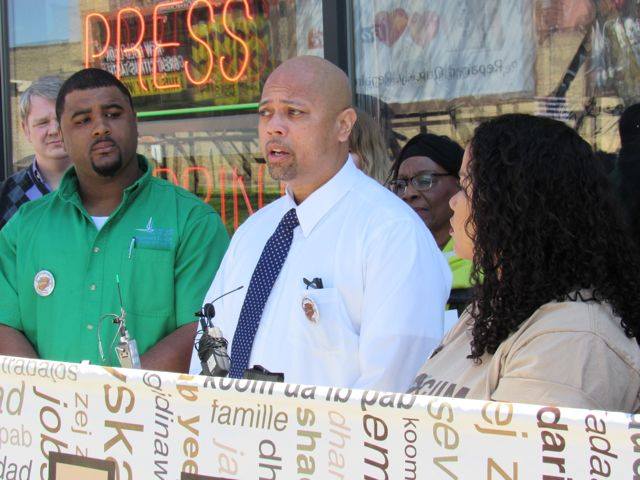 Frank Brown (center), owner of Minuteman Press at 2101 Hennepin Ave. So. in Minneapolis: "Making Minneapolis work better for people of color is a priority for everyone." He said the lack of paid sick days represents "a moral crisis facing our city." Photo by Steve Share, Minneapolis Labor Review